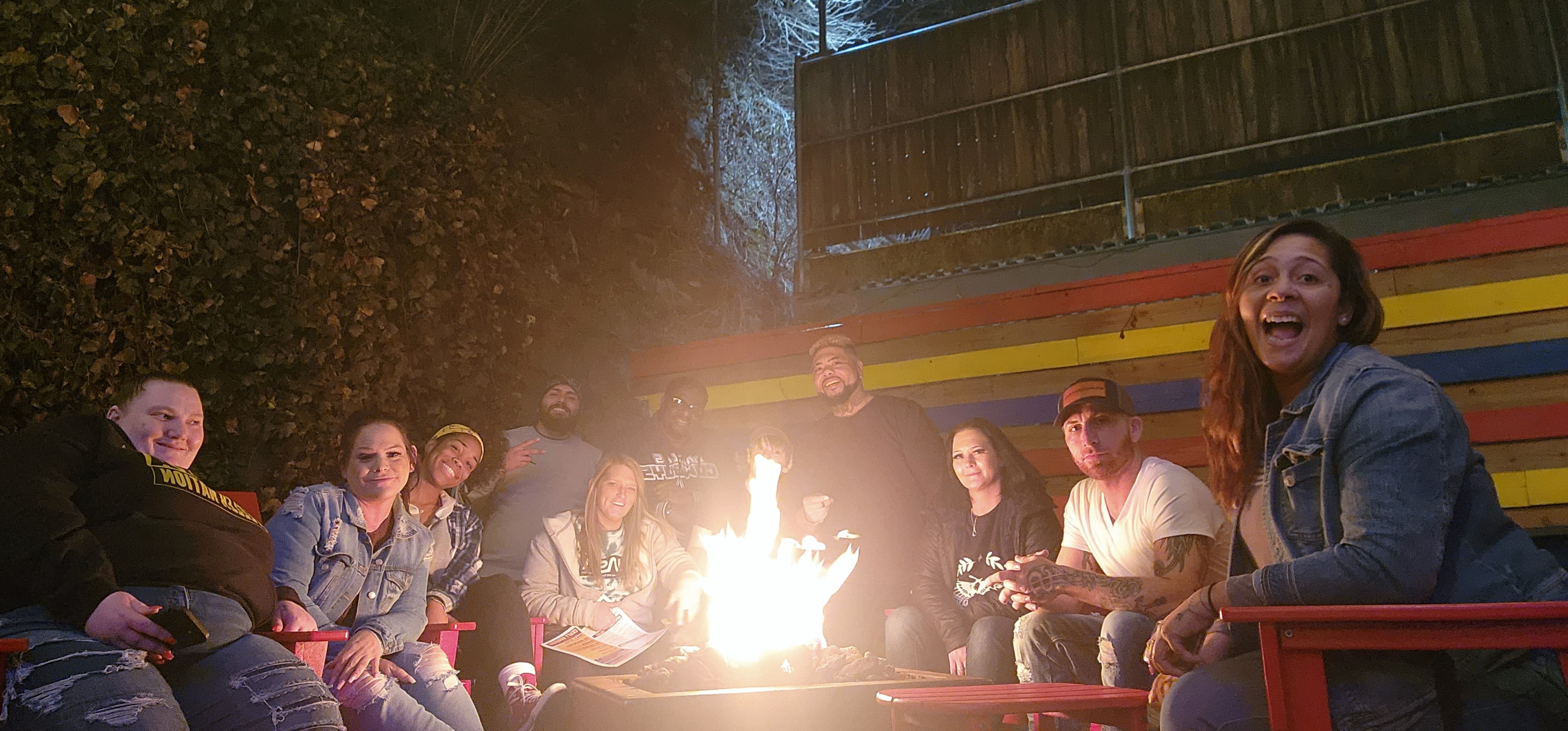 Laughter breaking out around the fire